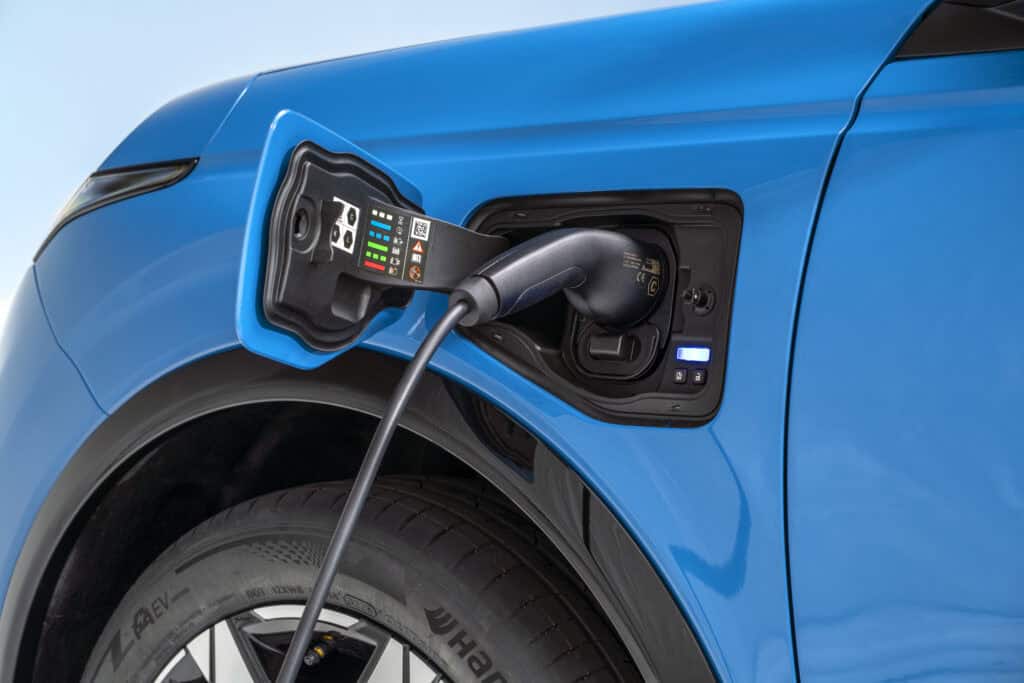 electric charging port with a charger plugged in